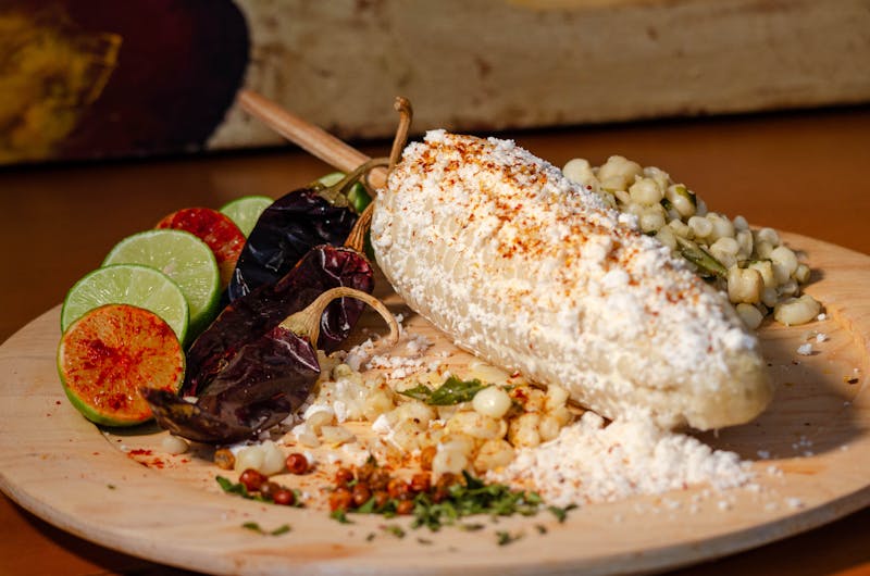 Elote Mexican street corn with cotija cheese and lime